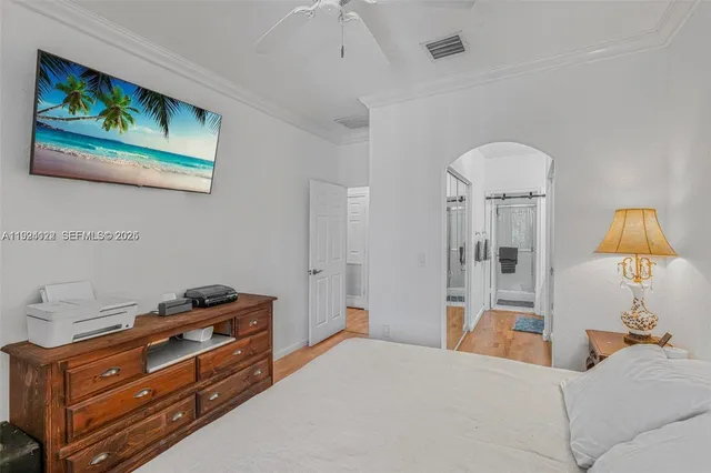 a bathroom with a tub mirror and shower