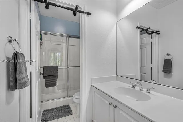 a bathroom with a shower and a toilet