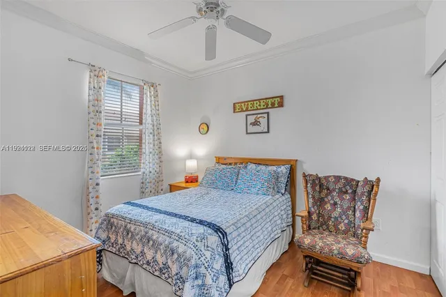 a bathroom with a sink a toilet and shower curtain