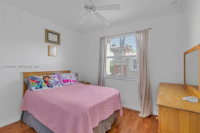 an aerial view of residential building with an outdoor space and seating