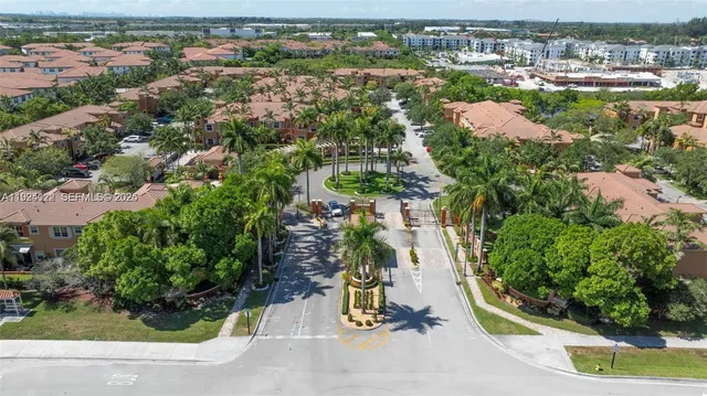 a front view of a house with a yard and table and chairs