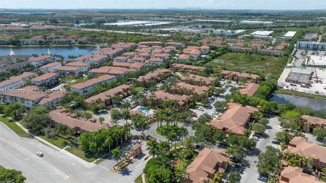 an aerial view of a house with a yard and a garden