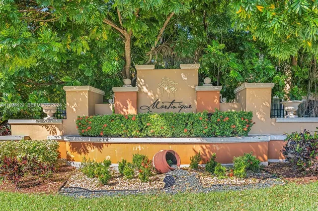 a view of swimming pool with a garden and outdoor seating