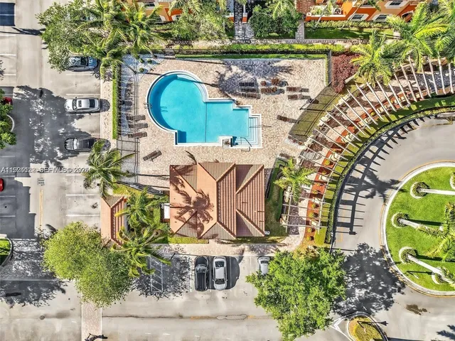 a view of a swimming pool with a patio