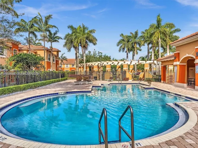 a view of a swimming pool with a patio