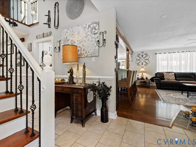 a living room with couches a dining table and chairs with outer view