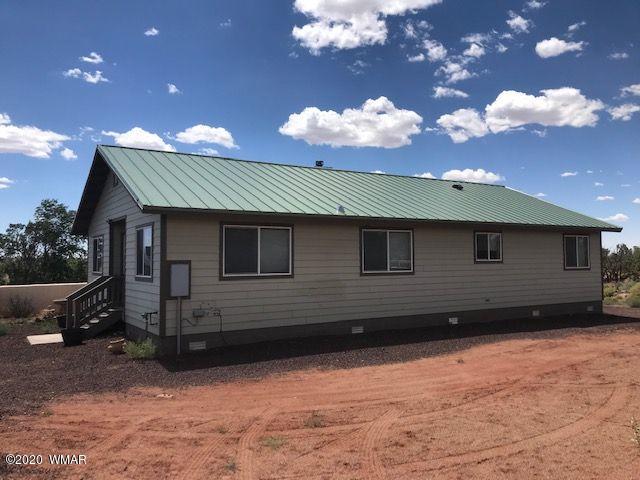 242 County Road Concho, AZ 85924 - Photo 16 of 28 a front view of a house with a yard