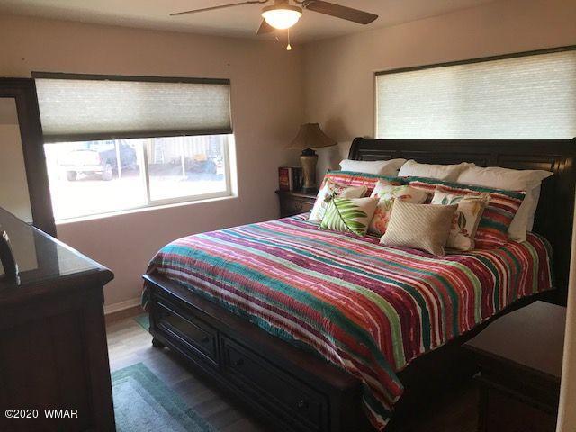 242 County Road Concho, AZ 85924 - Photo 18 of 28 a bedroom with a bed and window