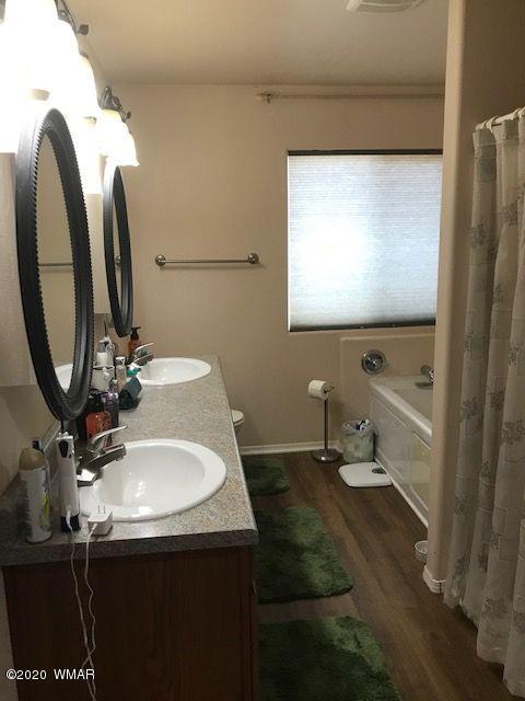 242 County Road Concho, AZ 85924 - Photo 19 of 28 a bathroom with a sink and a mirror