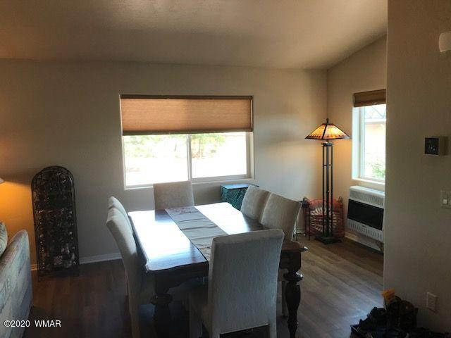 242 County Road Concho, AZ 85924 - Photo 21 of 28 a view of a dining room with furniture and a window