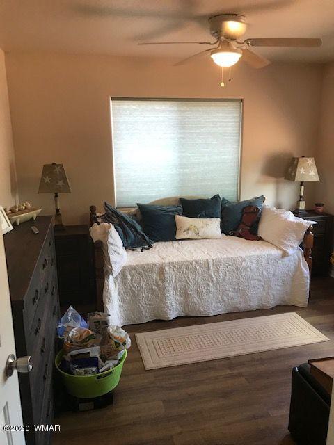 242 County Road Concho, AZ 85924 - Photo 23 of 28 a bedroom with a bed and a potted plant