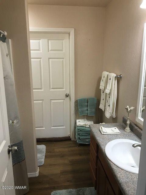 242 County Road Concho, AZ 85924 - Photo 24 of 28 a bathroom with a sink and a mirror