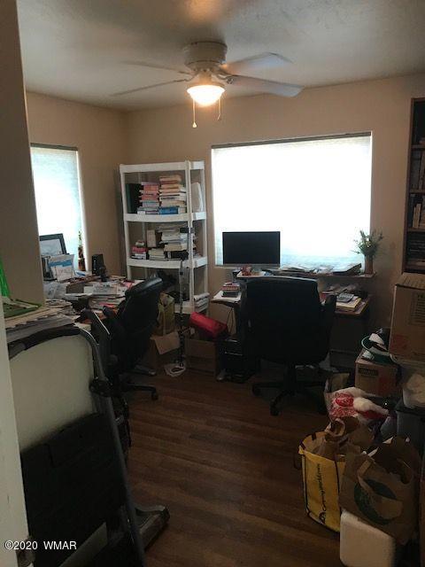 242 County Road Concho, AZ 85924 - Photo 25 of 28 a view of a workspace with furniture and a window