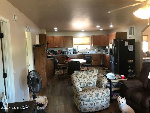 242 County Road Concho, AZ 85924 - Photo 26 of 28 a living room with furniture and a wooden floor