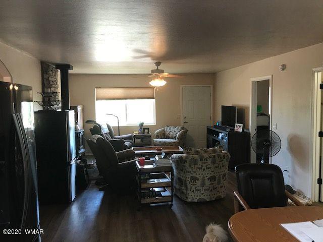 242 County Road Concho, AZ 85924 - Photo 28 of 28 a living room with furniture and a flat screen tv