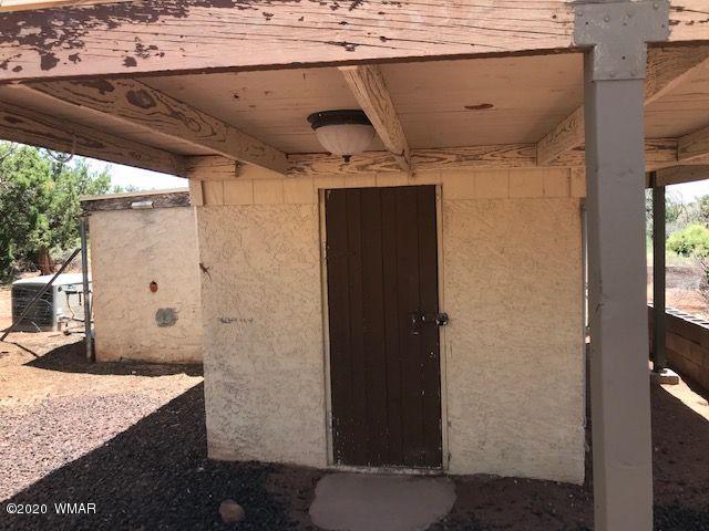 242 County Road Concho, AZ 85924 - Photo 10 of 28 a bathroom with a granite countertop sink and a mirror