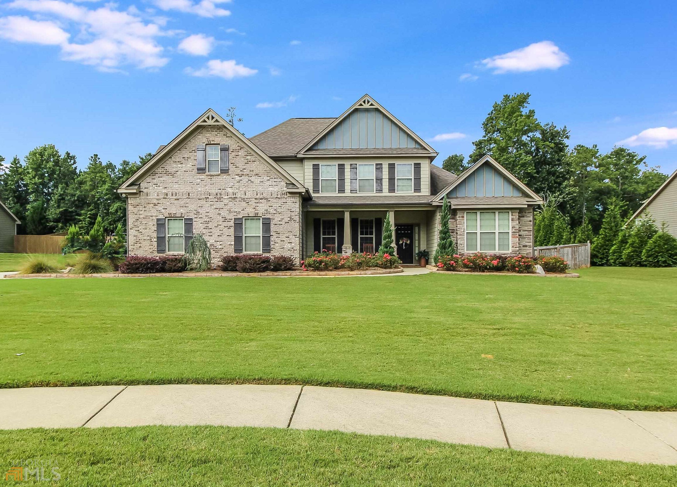 169 Caraway Road Locust Grove, GA 30248 - Photo 1 of 1 a front view of a house with a yard