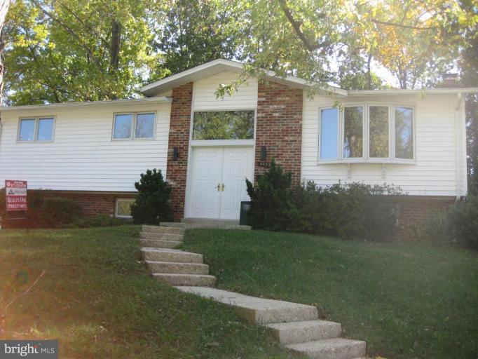 8455 Thames Street Springfield, VA 22151 - Photo 1 of 19 a front view of a house with a yard