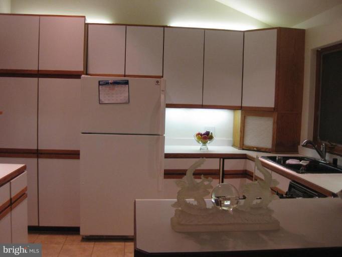 8455 Thames Street Springfield, VA 22151 - Photo 6 of 19 a kitchen with a sink and cabinets