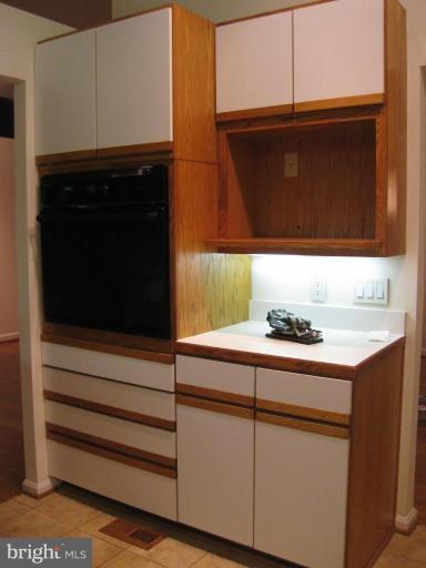 8455 Thames Street Springfield, VA 22151 - Photo 7 of 19 a bathroom with a sink and a microwave