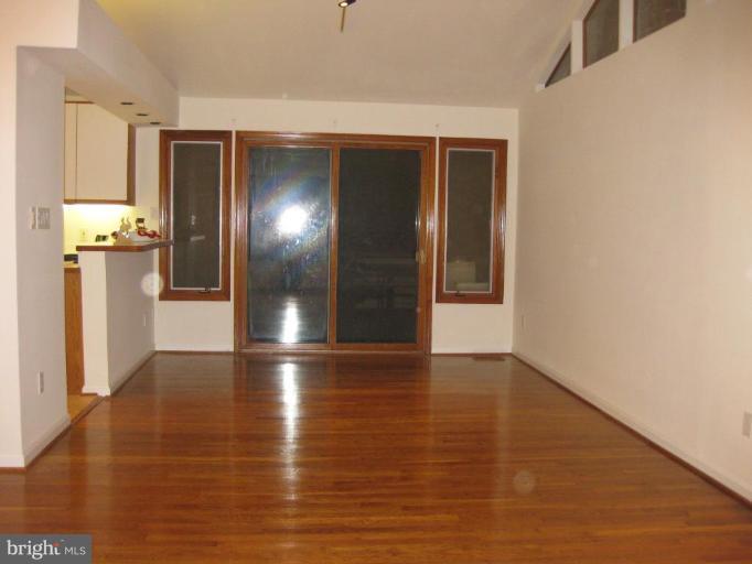 8455 Thames Street Springfield, VA 22151 - Photo 8 of 19 a view of empty room with wooden floor