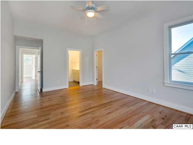1109 Rugby Road Charlottesville, VA 22903 - Photo 24 of 38 a room with wooden floor and windows