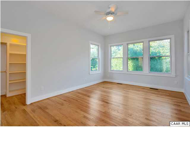 1109 Rugby Road Charlottesville, VA 22903 - Photo 25 of 38 an empty room with wooden floor and windows
