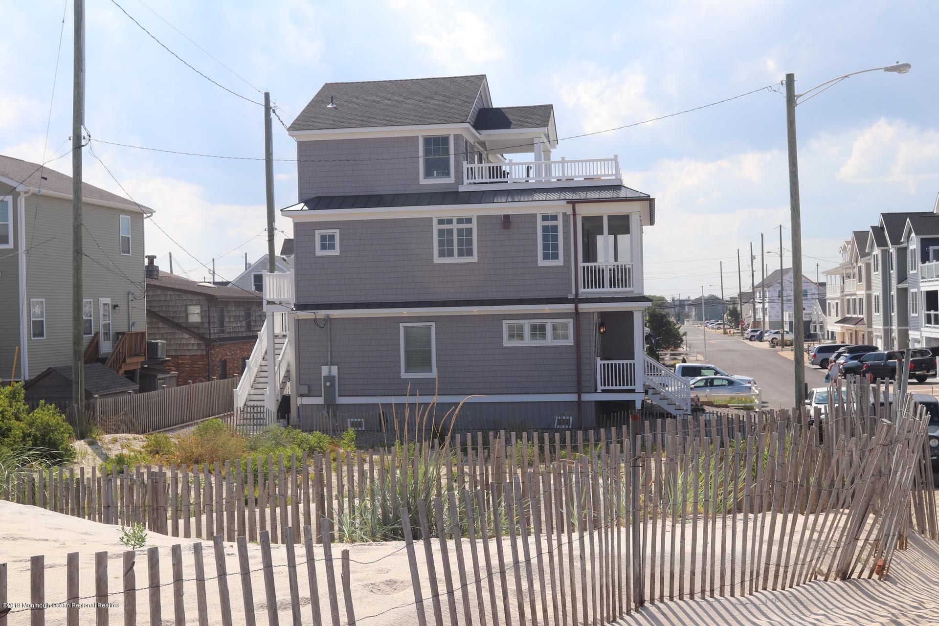 21 Silver Beach Road Lavallette, NJ 08735 - Photo 16 of 25 a view of a house with a wooden fence
