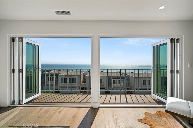 a bathroom with a granite countertop shower sink and mirror