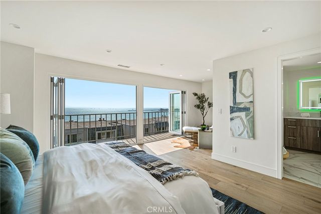 a bathroom with a granite countertop shower a sink and toilet