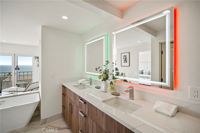 an aerial view of ocean and residential houses