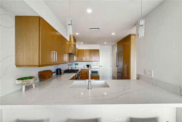 a view of a hallway with wooden floor and closet