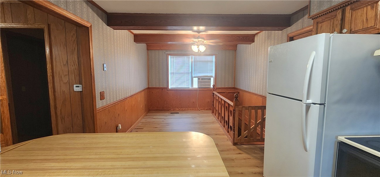 9090 Radcliffe Road Adamsville, OH 43802 - Photo 4 of 19 Kitchen with beamed ceiling, white fridge, and light wood-type flooring