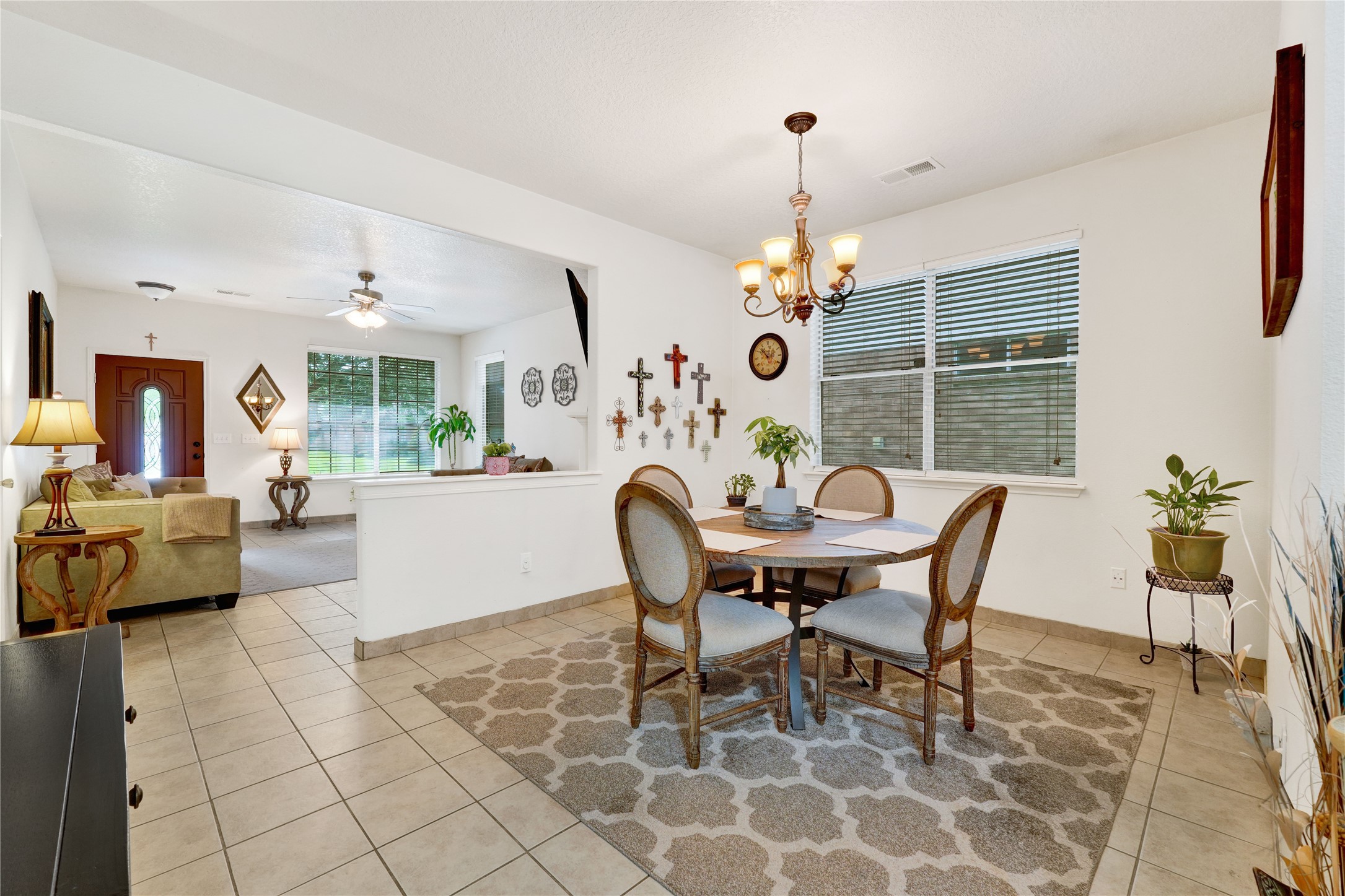 2923 Rising Sun Road Katy, TX 77449 - Photo 11 of 35 a dining room with furniture a chandelier and wooden floor