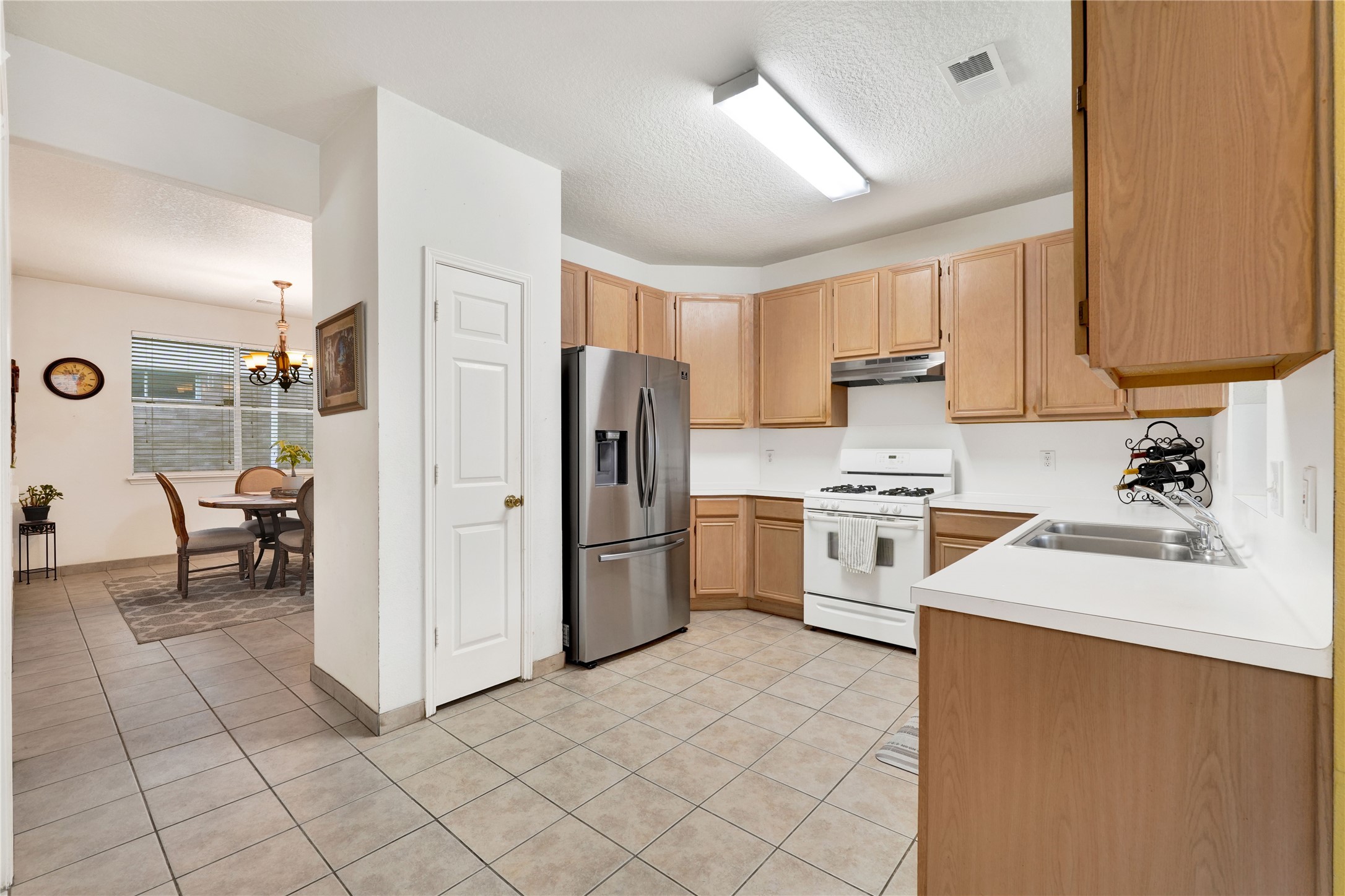 2923 Rising Sun Road Katy, TX 77449 - Photo 14 of 35 a kitchen with a refrigerator sink and cabinets