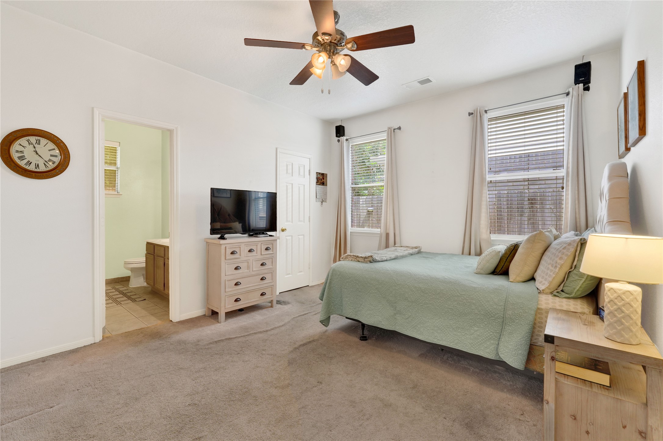 2923 Rising Sun Road Katy, TX 77449 - Photo 20 of 35 a bedroom with a bed and a flat screen tv