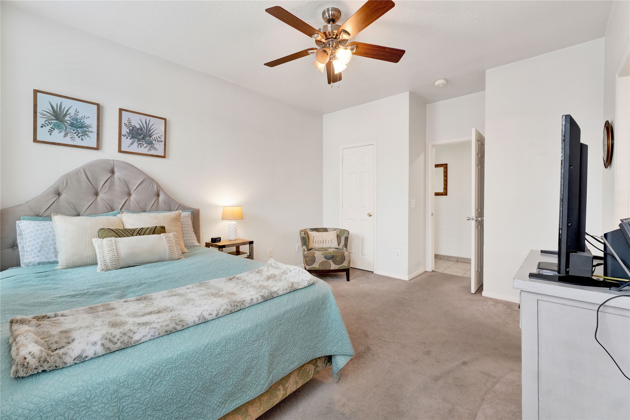 2923 Rising Sun Road Katy, TX 77449 - Photo 21 of 35 a bedroom with a bed and a flat screen tv