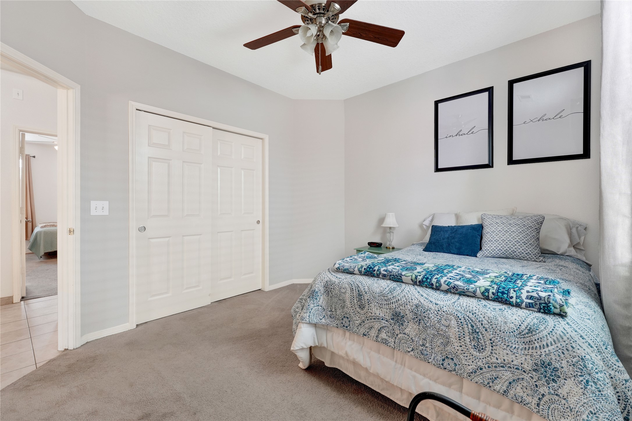 2923 Rising Sun Road Katy, TX 77449 - Photo 24 of 35 a bedroom with a large bed and ceiling fan