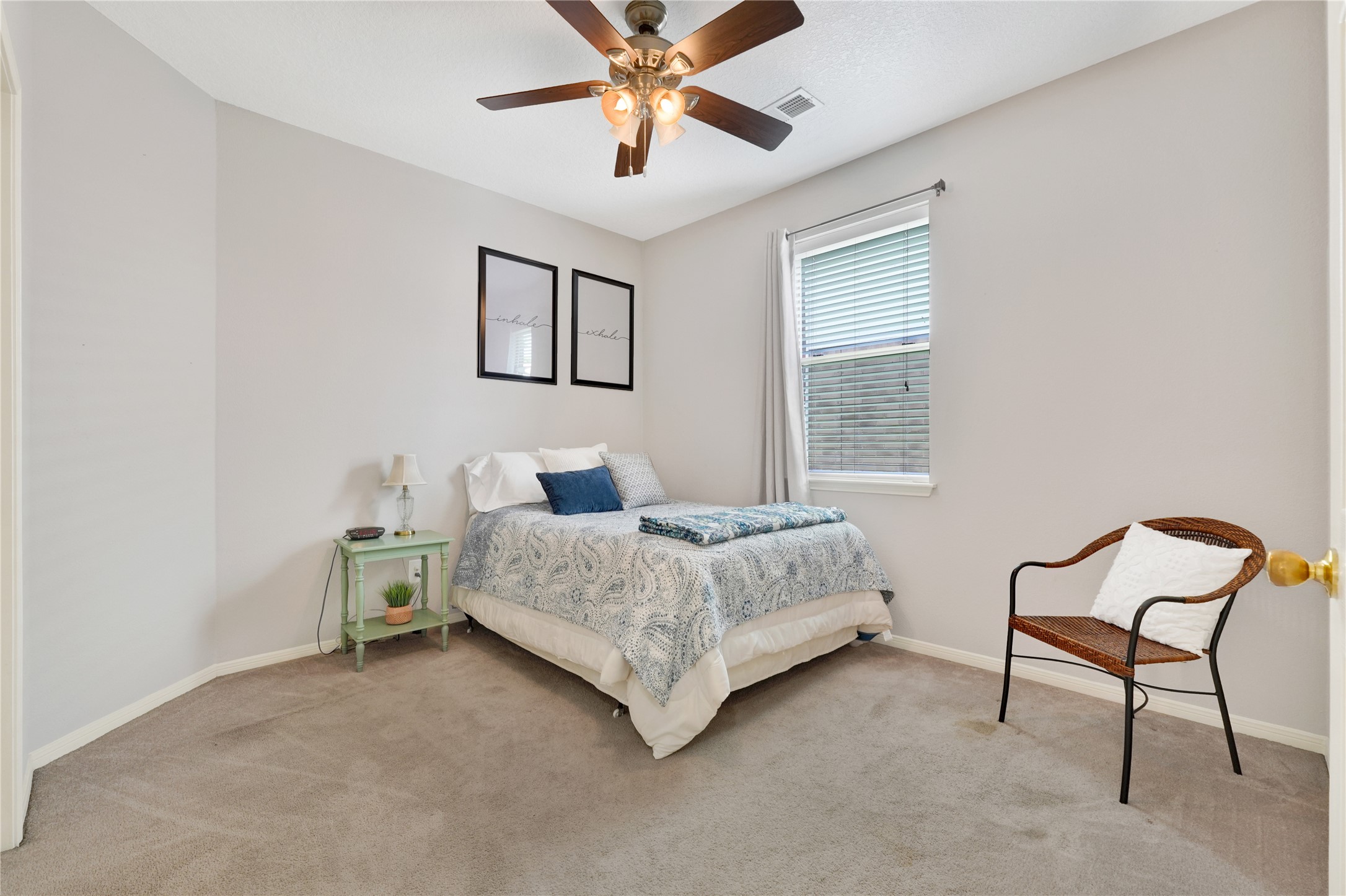 2923 Rising Sun Road Katy, TX 77449 - Photo 25 of 35 a bedroom with a bed and a chandelier