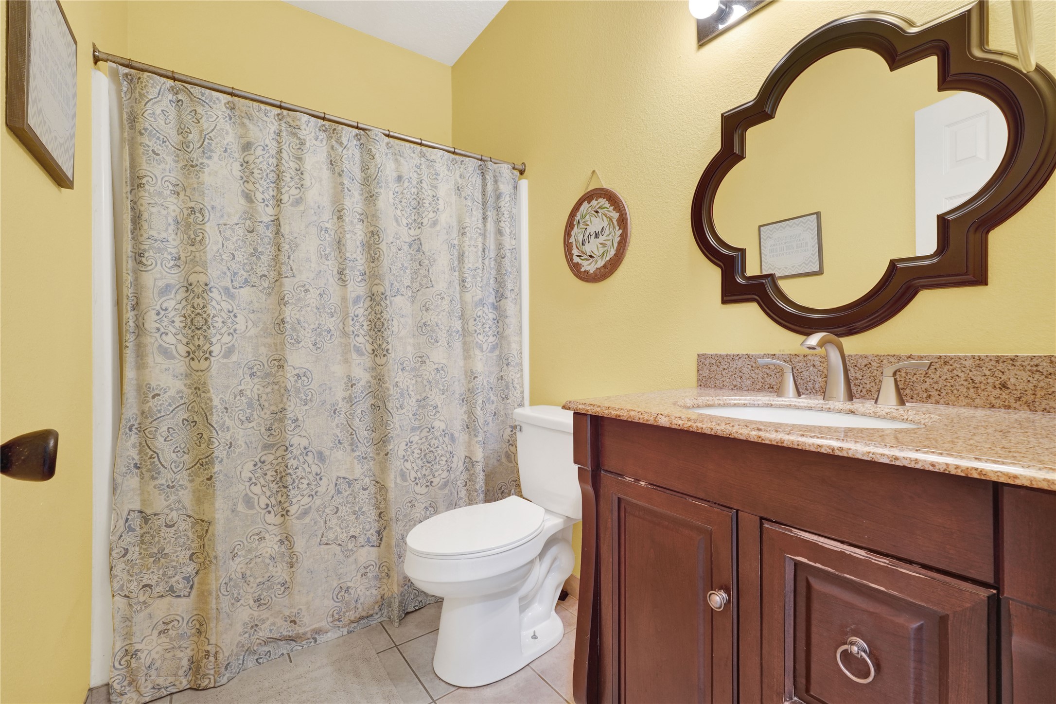 2923 Rising Sun Road Katy, TX 77449 - Photo 27 of 35 a bathroom with a sink mirror and toilet