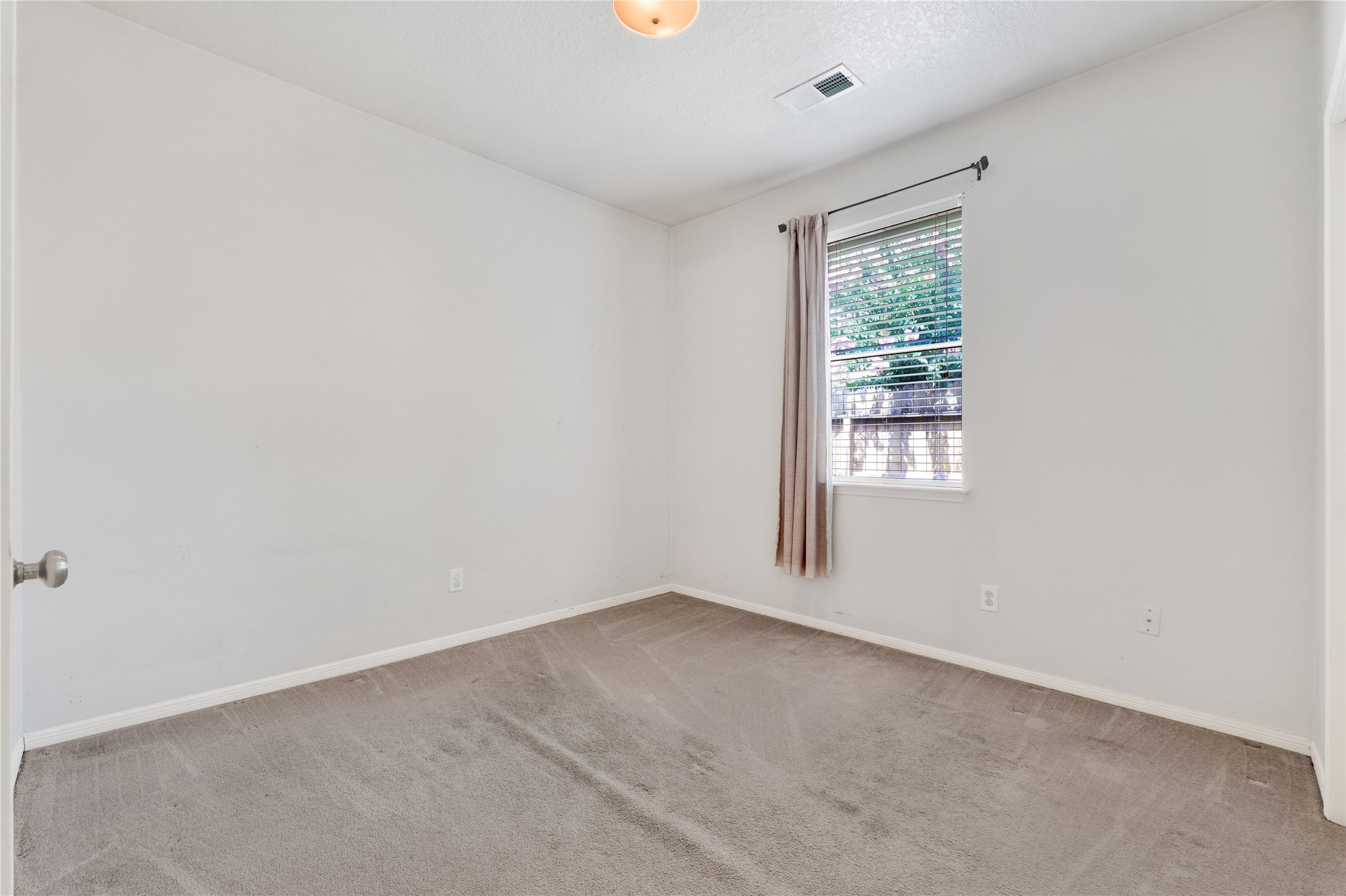 2923 Rising Sun Road Katy, TX 77449 - Photo 28 of 35 an empty room with windows