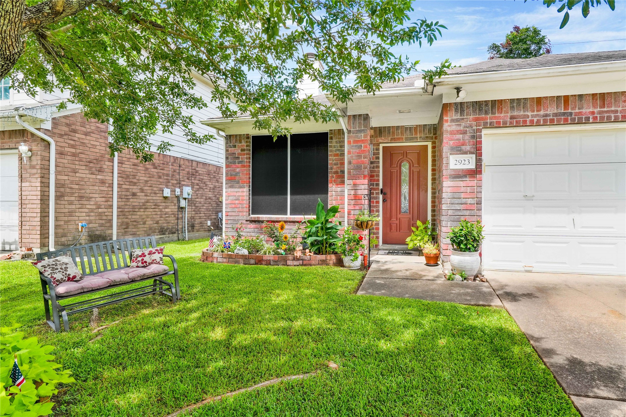 2923 Rising Sun Road Katy, TX 77449 - Photo 3 of 35 a front view of a house with garden