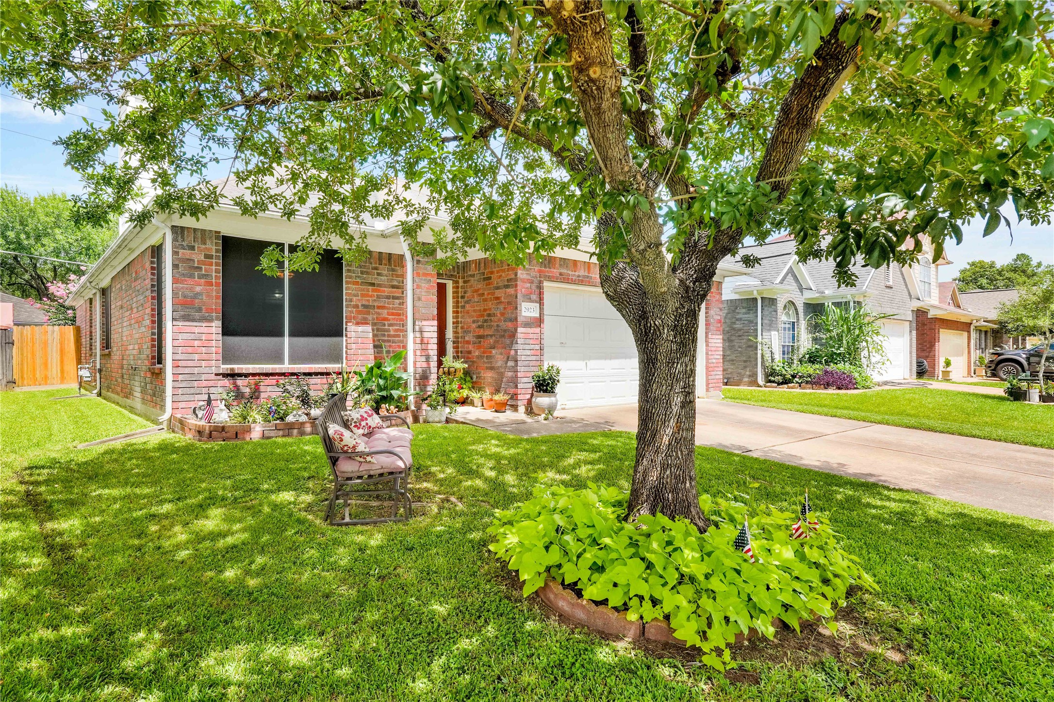 2923 Rising Sun Road Katy, TX 77449 - Photo 4 of 35 a front view of a house with garden