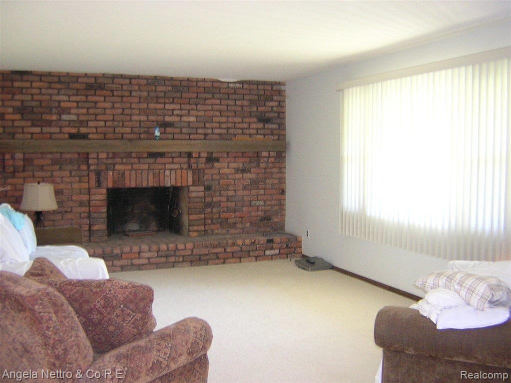 10924 Bunton Road Willis, MI 48191 - Photo 13 of 24 LIVING ROOM FIREPLACE
