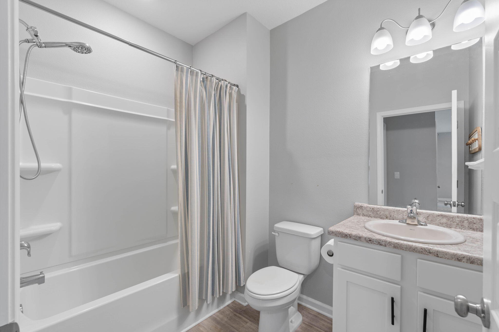 38 Silverthorn Street Freeport, FL 32439 - Photo 28 of 42 a bathroom with a granite countertop sink toilet and shower