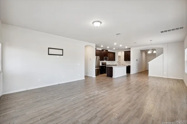 a view of kitchen with furniture and wooden floor