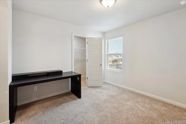 a view of a hallway with workspace