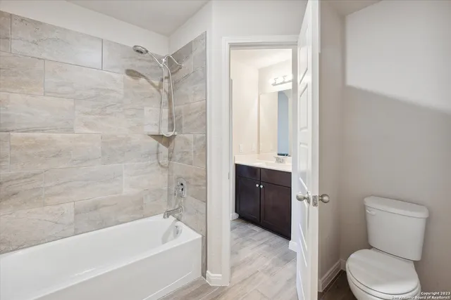 a bathroom with a sink vanity and a mirror