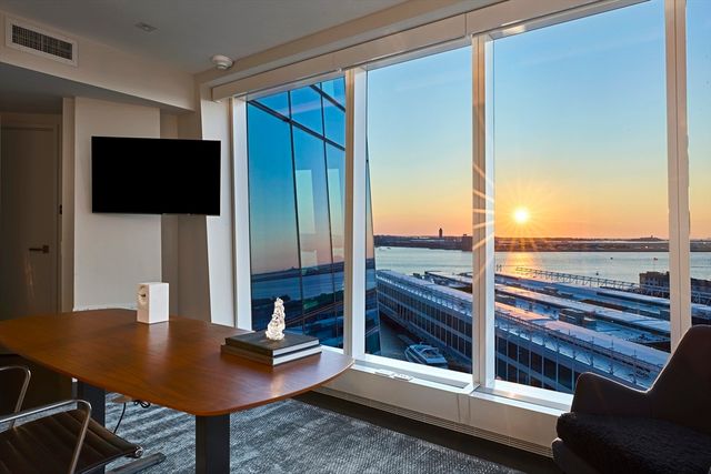 a workspace with furniture and window