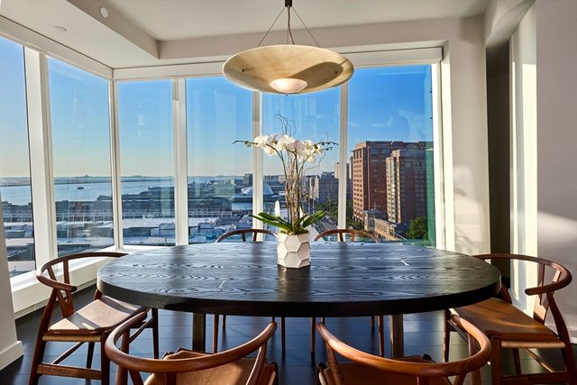 a view of a dining room with furniture window and chandelier